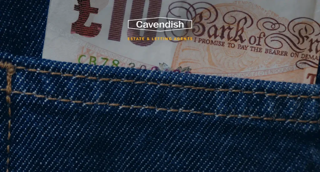 Ten pound note in a denim pocket representing Chester house prices and inflation